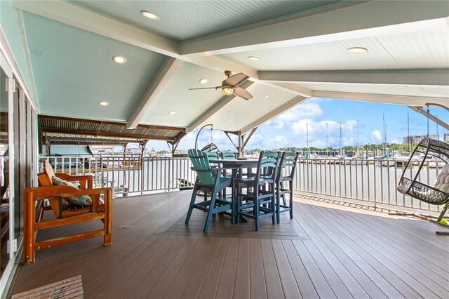 7930 Breakwater Drive 52&53, New Orleans, LA 70124 - wooden terrace with outdoor dining area and a water view