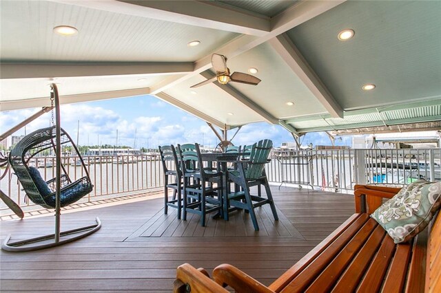 7930 Breakwater Drive 52&53, New Orleans, LA 70124 - wooden terrace with a water view, outdoor dining space, and a ceiling fan