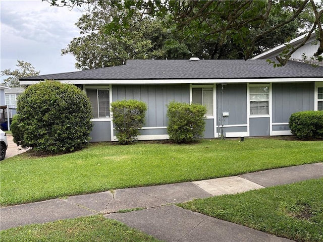 16 Sycamore Ln, Saint Rose, LA 70087 - ranch-style home with board and batten siding, a shingled roof, and a front yard