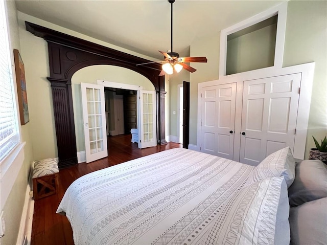 2415 Columbus St, New Orleans, LA 70119 - bedroom featuring baseboards, french doors, wood finished floors, and ceiling fan