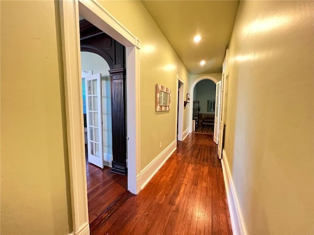 2415 Columbus St, New Orleans, LA 70119 - corridor with arched walkways, baseboards, dark wood-style flooring, and recessed lighting