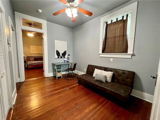 2415 Columbus St, New Orleans, LA 70119 - living area featuring hardwood / wood-style flooring, baseboards, and a ceiling fan