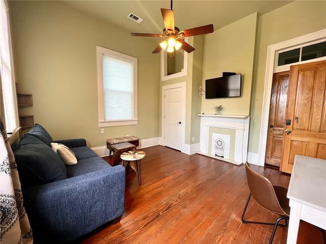 2415 Columbus St, New Orleans, LA 70119 - living room featuring hardwood / wood-style floors, visible vents, baseboards, and ceiling fan