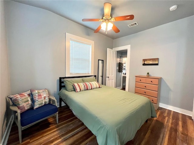 2415 Columbus St, New Orleans, LA 70119 - bedroom with dark wood finished floors, baseboards, a ceiling fan, and visible vents