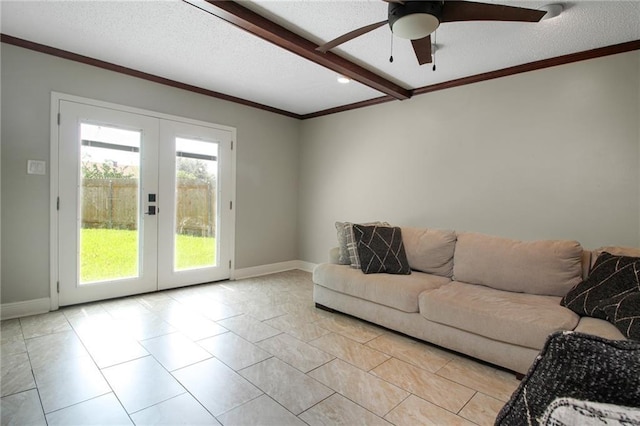 2172 Carmel Valley Dr, La Place, LA 70068 - living room with baseboards, ornamental molding, a ceiling fan, and french doors