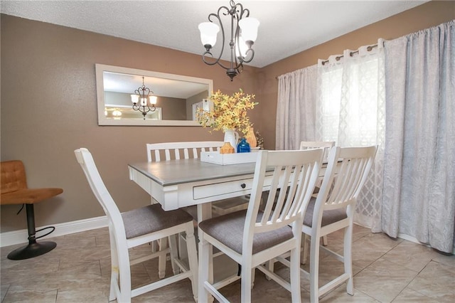 2172 Carmel Valley Dr, La Place, LA 70068 - dining room with an inviting chandelier and baseboards