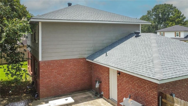 2172 Carmel Valley Dr, La Place, LA 70068 - view of side of property with roof with shingles and brick siding