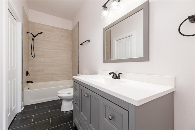 full bath featuring vanity, tile patterned flooring,  shower combination, and toilet