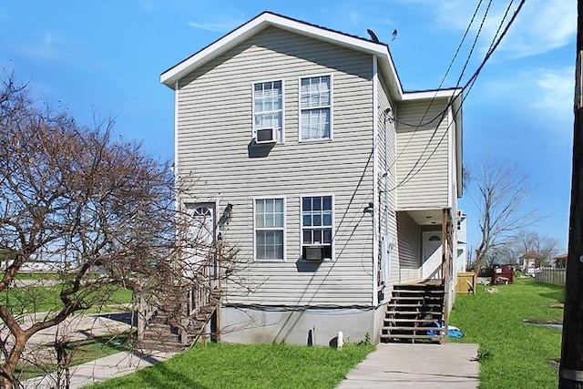 264749 Louisa St, New Orleans, LA 70117 - exterior space with a front lawn and cooling unit