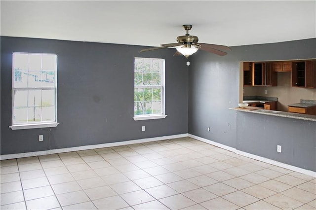 264749 Louisa St, New Orleans, LA 70117 - empty room with baseboards and ceiling fan