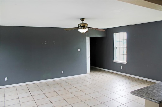 264749 Louisa St, New Orleans, LA 70117 - spare room featuring ceiling fan, baseboards, and light tile patterned flooring