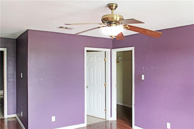 264749 Louisa St, New Orleans, LA 70117 - unfurnished bedroom with baseboards, wood finished floors, visible vents, and a closet