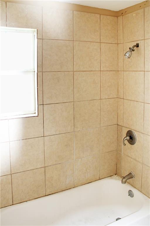 264749 Louisa St, New Orleans, LA 70117 - bathroom featuring shower / bathing tub combination