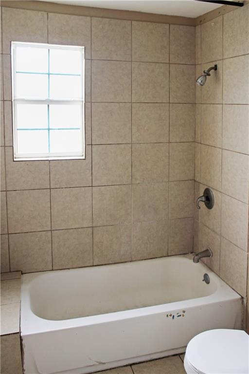 264749 Louisa St, New Orleans, LA 70117 - bathroom featuring bathing tub / shower combination, tile patterned flooring, and toilet