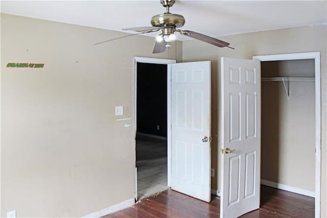264749 Louisa St, New Orleans, LA 70117 - unfurnished bedroom with ceiling fan, baseboards, wood finished floors, and a closet