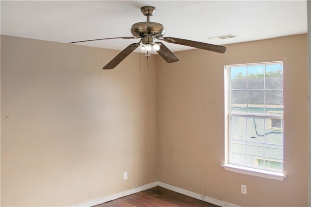 264749 Louisa St, New Orleans, LA 70117 - empty room with dark wood-style floors, baseboards, ceiling fan, and visible vents