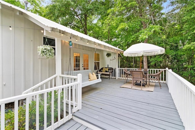 71463 Haynes St, Abita Springs, LA 70420 - wooden terrace with outdoor dining area