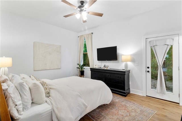 71463 Haynes St, Abita Springs, LA 70420 - bedroom featuring light wood-style flooring, baseboards, access to outside, and ceiling fan