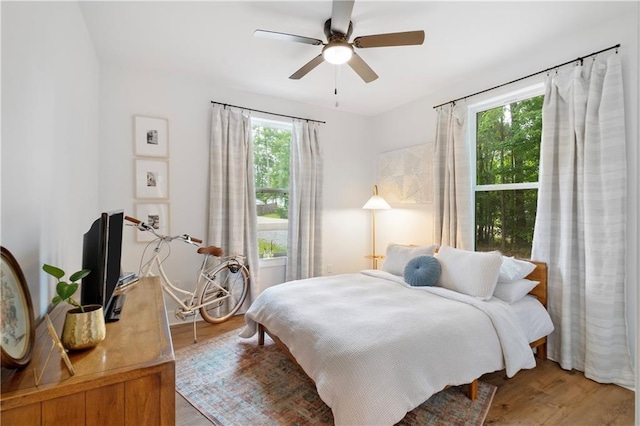 71463 Haynes St, Abita Springs, LA 70420 - bedroom with light wood-style floors and ceiling fan