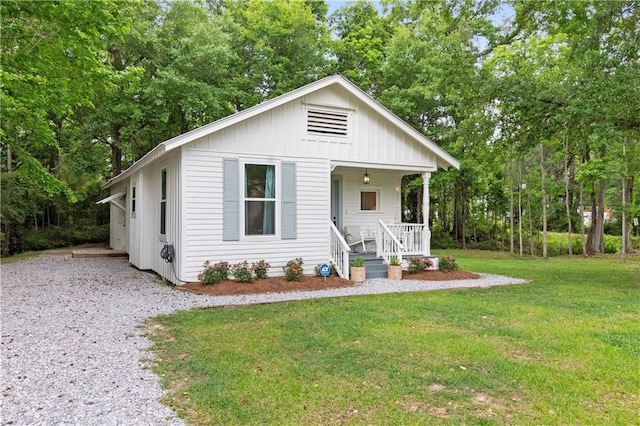 71463 Haynes St, Abita Springs, LA 70420 - bungalow-style house with a porch, board and batten siding, and a front yard