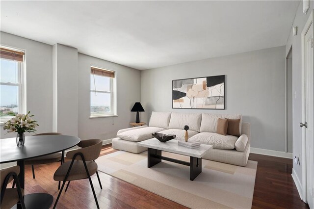1205 St Charles Ave Unit 714, New Orleans, LA 70130 - living area with dark wood finished floors and baseboards