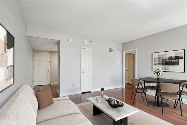1205 St Charles Ave Unit 714, New Orleans, LA 70130 - living area featuring baseboards, wood finished floors, and visible vents