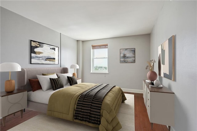 1205 St Charles Ave Unit 714, New Orleans, LA 70130 - bedroom with baseboards and wood finished floors