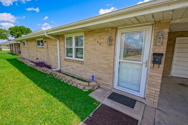 1021 Maplewood Dr, Harvey, LA 70058 - property entrance featuring a yard and brick siding