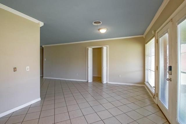 1021 Maplewood Dr, Harvey, LA 70058 - empty room with baseboards, light tile patterned floors, ornamental molding, and a wealth of natural light