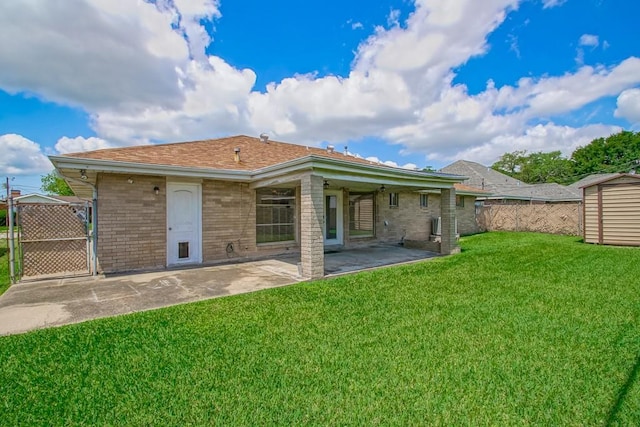 1021 Maplewood Dr, Harvey, LA 70058 - back of property with a patio, a gate, a lawn, brick siding, and fence