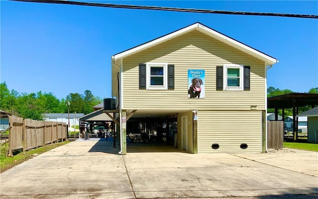 31763 Shelton Dr, Springfield, LA 70462 - exterior space with driveway, a carport, and fence