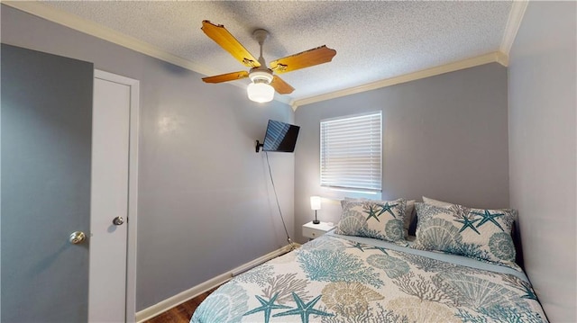 31763 Shelton Dr, Springfield, LA 70462 - bedroom featuring wood finished floors, a textured ceiling, and crown molding