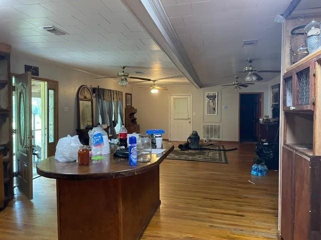46038 Wooding Ln, Franklinton, LA 70438 - kitchen with a ceiling fan, light wood finished floors, open floor plan, and a kitchen island