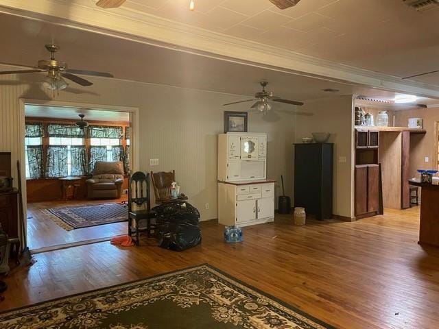 46038 Wooding Ln, Franklinton, LA 70438 - living room featuring a ceiling fan, wood finished floors, and crown molding