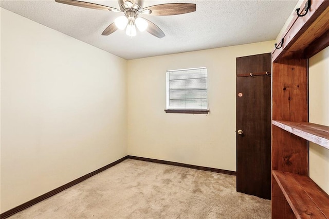 716 N Woodlawn Ave, Metairie, LA 70001 - spare room featuring light colored carpet, baseboards, a textured ceiling, and ceiling fan