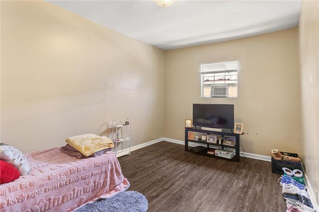 920 N Prieur St, New Orleans, LA 70116 - bedroom with baseboards and wood finished floors