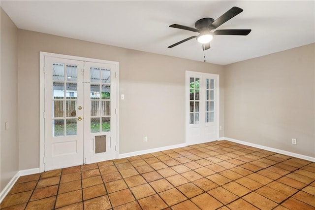4738 Banks St, New Orleans, LA 70119 - entryway with french doors, ceiling fan, and baseboards