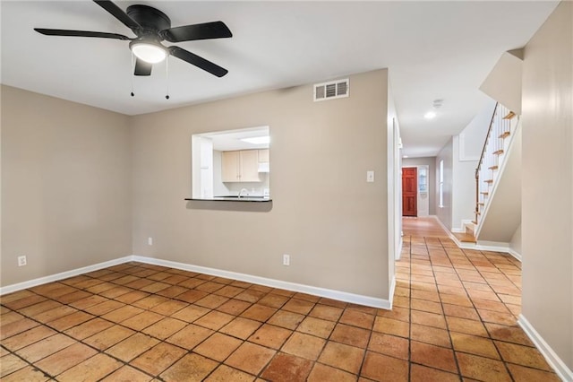 4738 Banks St, New Orleans, LA 70119 - empty room with baseboards, stairway, a ceiling fan, light tile patterned floors, and recessed lighting