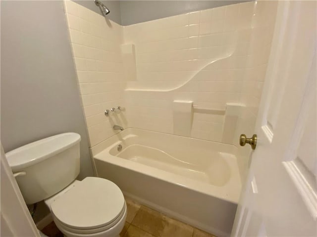 full bathroom featuring toilet,  shower combination, and tile patterned flooring