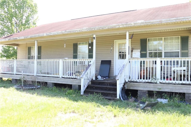 entrance to property with covered porch