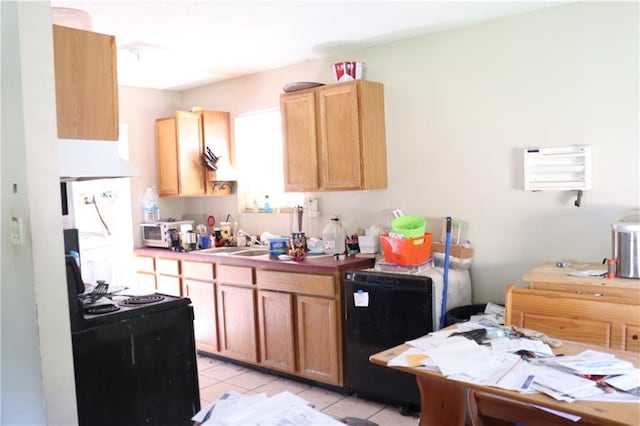 kitchen featuring refrigerator, a sink, black range with electric cooktop, light tile patterned flooring, and under cabinet range hood