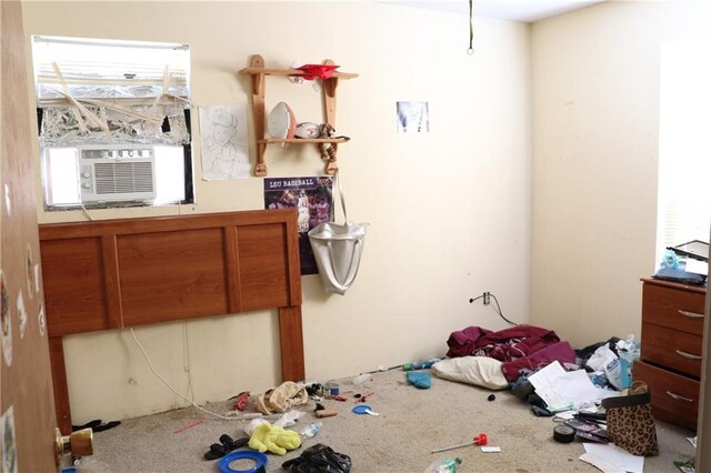unfurnished bedroom with multiple windows and cooling unit