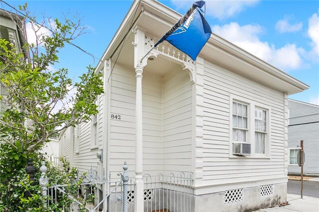842 Toledano St, New Orleans, LA 70115 - view of side of property with fence, crawl space, and cooling unit