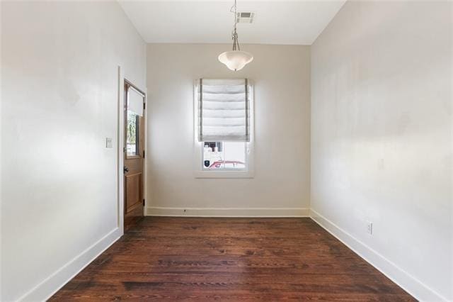842 Toledano St, New Orleans, LA 70115 - empty room featuring dark wood finished floors, visible vents, and baseboards