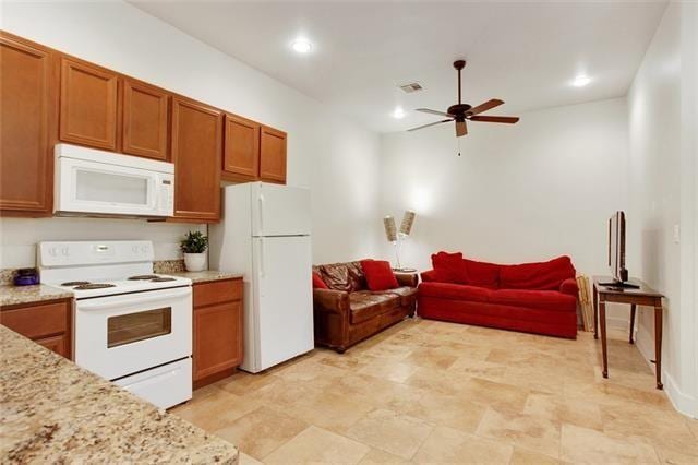 842 Toledano St, New Orleans, LA 70115 - kitchen with recessed lighting, a ceiling fan, white appliances, brown cabinetry, and open floor plan