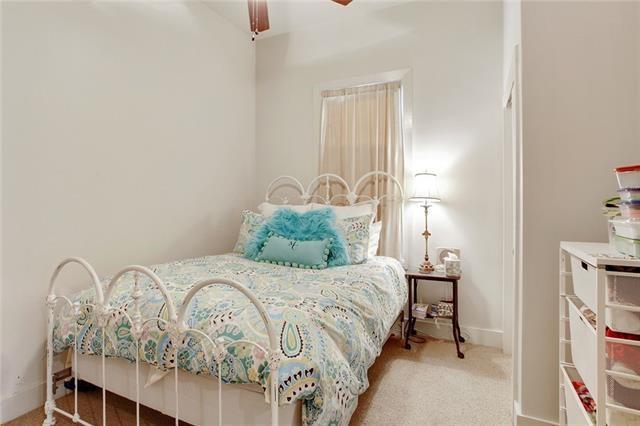 842 Toledano St, New Orleans, LA 70115 - carpeted bedroom with baseboards and a ceiling fan