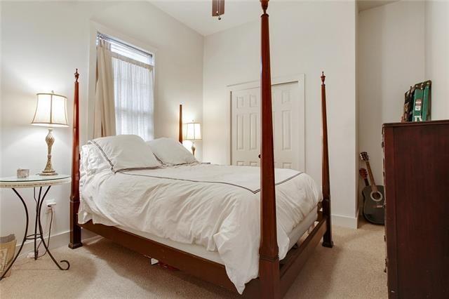 842 Toledano St, New Orleans, LA 70115 - bedroom with light carpet, a ceiling fan, and baseboards