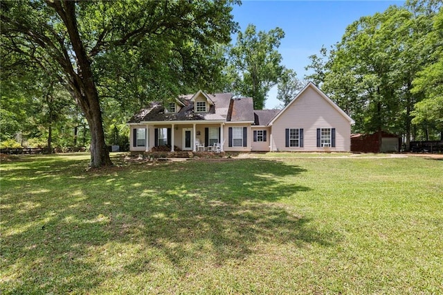 52475 Wilson Rd, Folsom, LA 70437 - cape cod-style house featuring a front lawn and covered porch