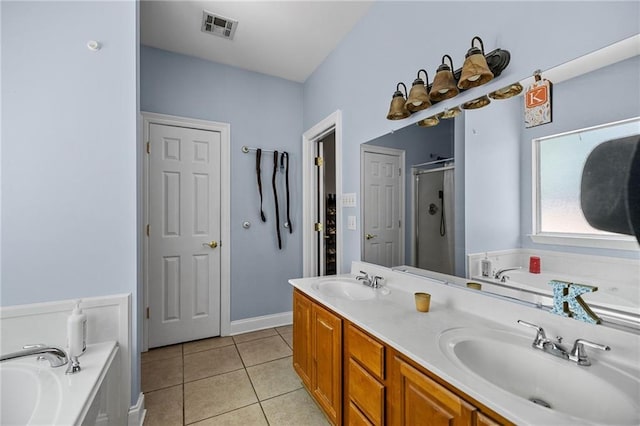 52475 Wilson Rd, Folsom, LA 70437 - bathroom featuring a shower stall, a garden tub, tile patterned flooring, and double vanity