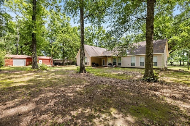 52475 Wilson Rd, Folsom, LA 70437 - view of yard featuring an outdoor structure and a garage